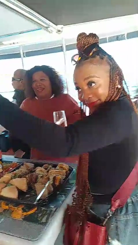 Friends enjoying food and drinks during a leisure experience