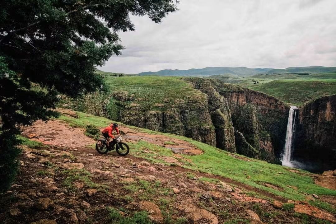 Mountain cyclist riding beside Maletsunyane Falls